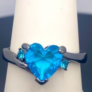 Sky blue heart shaped stone layer in a chrome setting tone ring